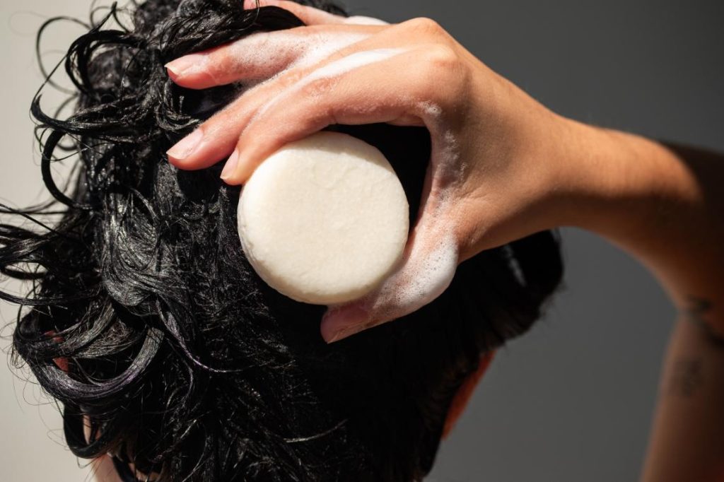 lather shampoo bar into hair